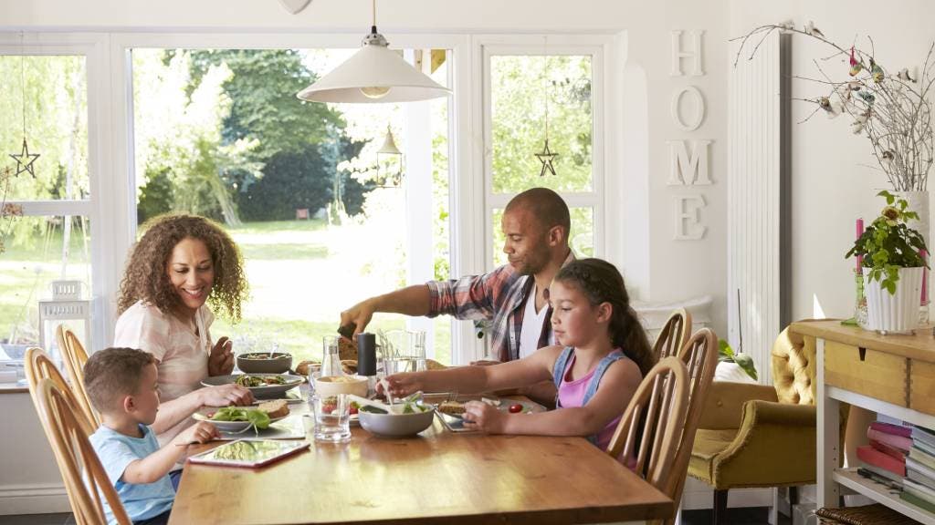 family at dinner table in home