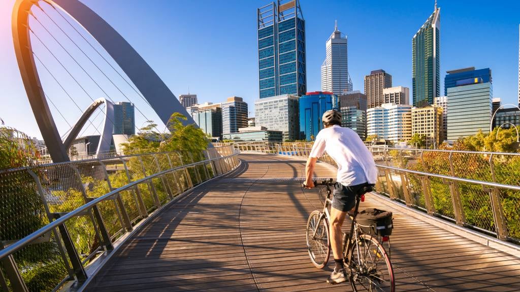 Male cyclist rides through scenic location. 