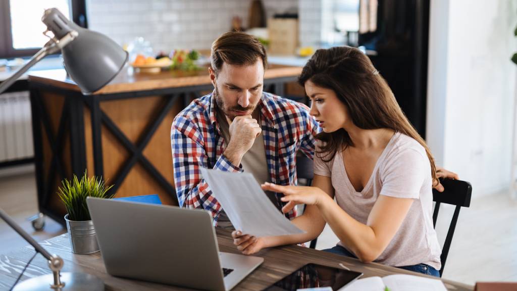 young couple looking at life insurance costs 