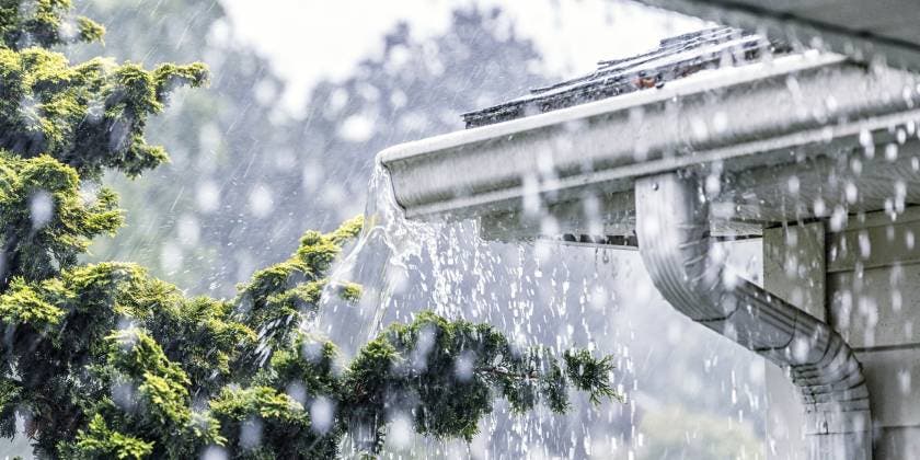 heavy rainfall damaging house