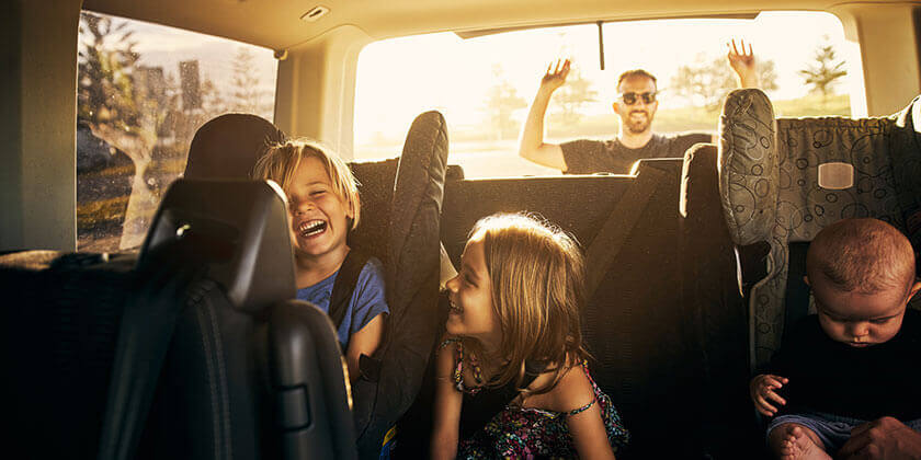 young family in car