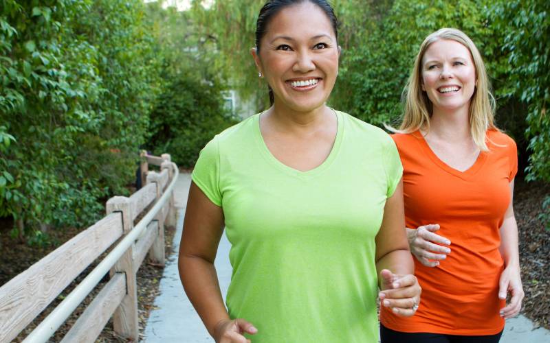 two women in 40s jogging
