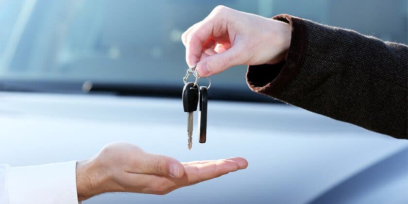 handing over keys to sold car