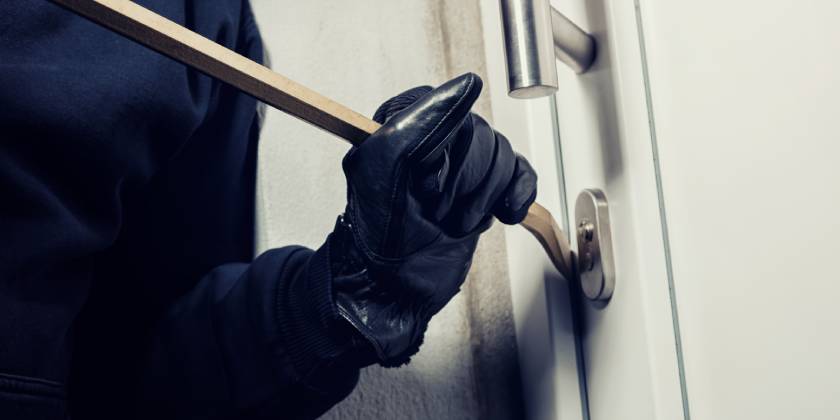 burglar breaking into house