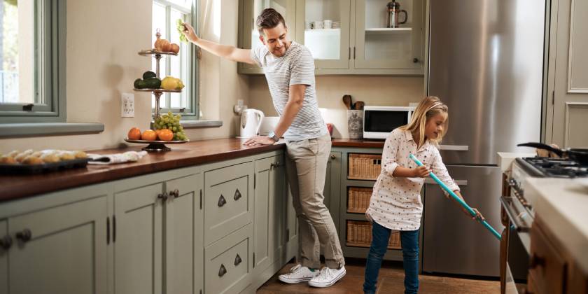 dad and daughter cleaning house