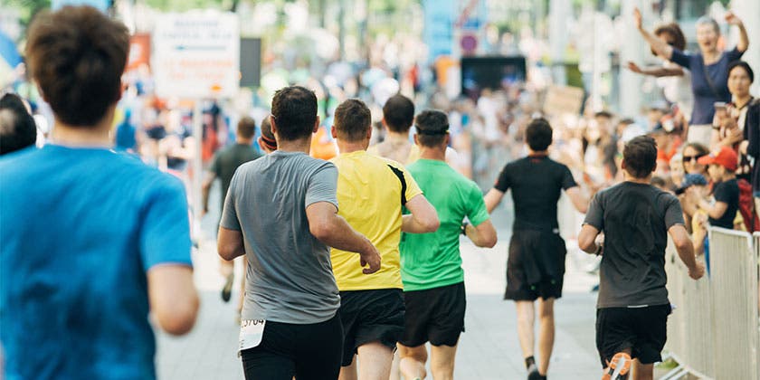 group of people running together in race