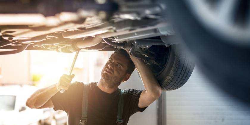 mechanic working under car