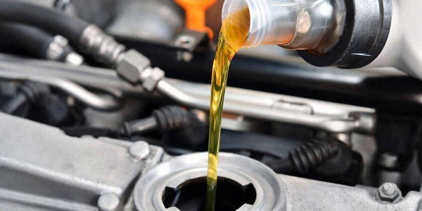 oil being poured into engine