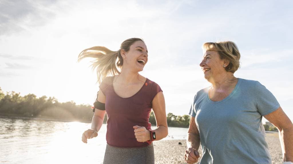 Granddaughter and grandmother having fun, jogging together