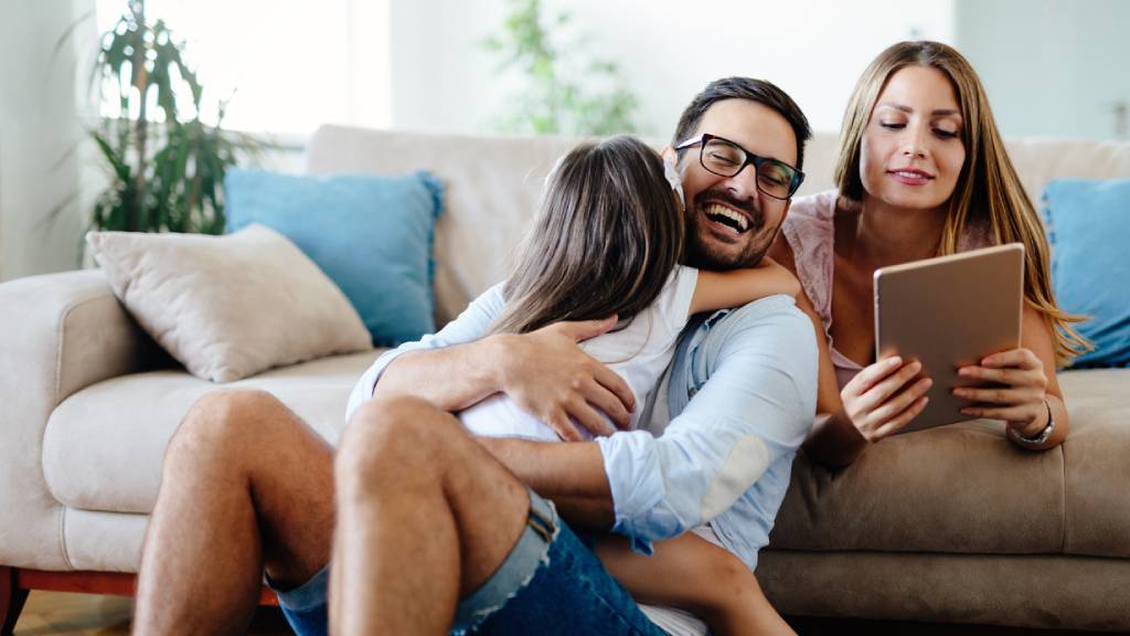 young family with parents discussing life insurance