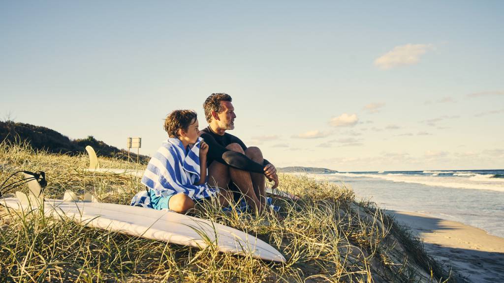 father and son on Australian beach 