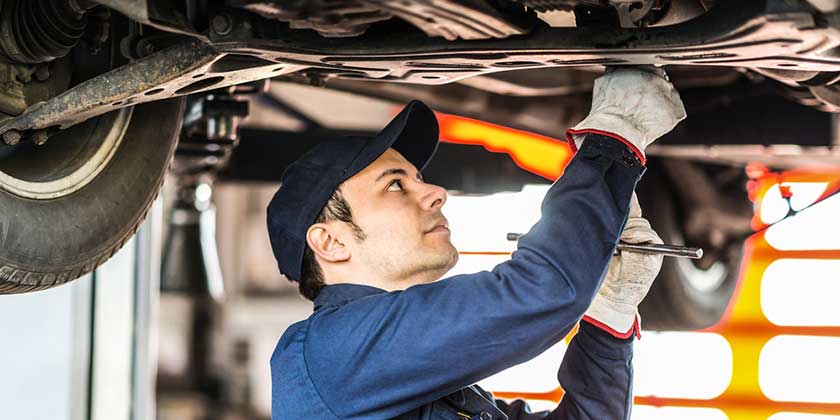 mechanic working under car