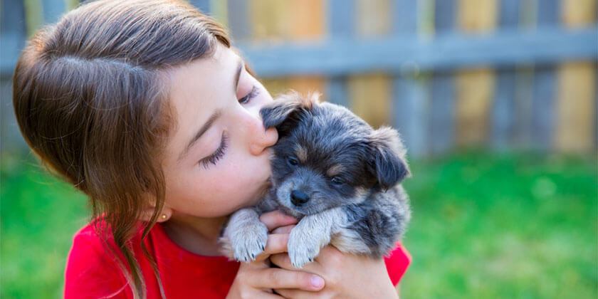 young girl with new puppy