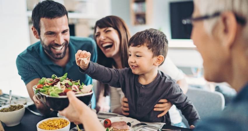 An extended family enjoying a meal together