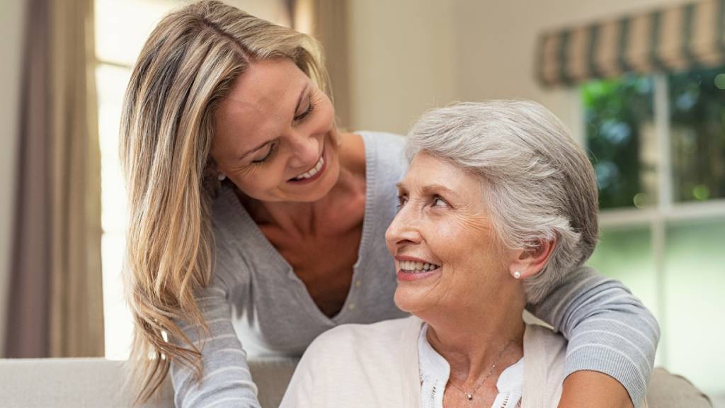 older woman and daughter hugging 