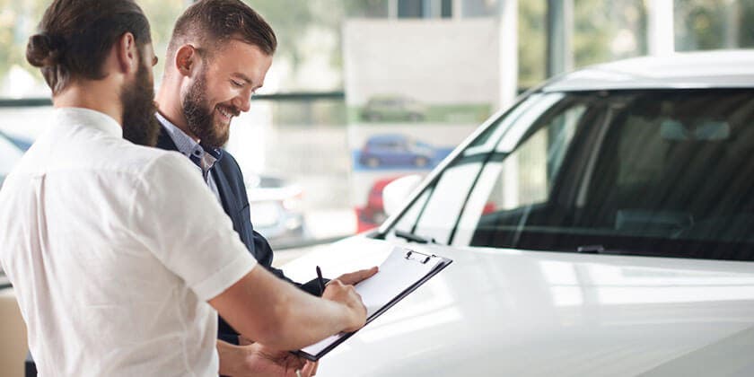 discussion at a car dealership