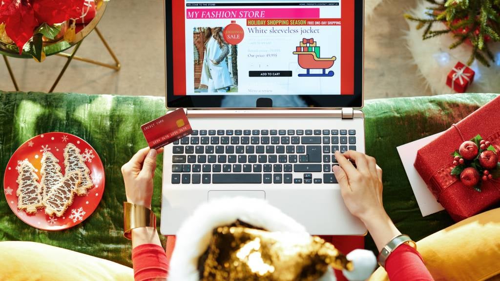 Woman at laptop shops online for Christmas