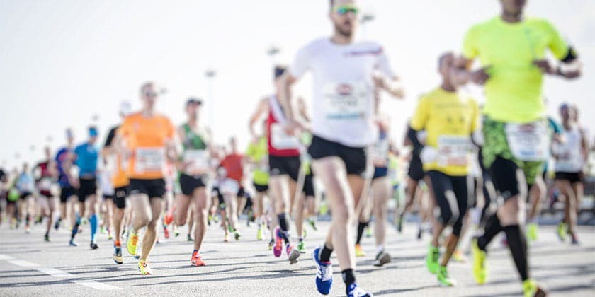 Group of runners in colourful running gear