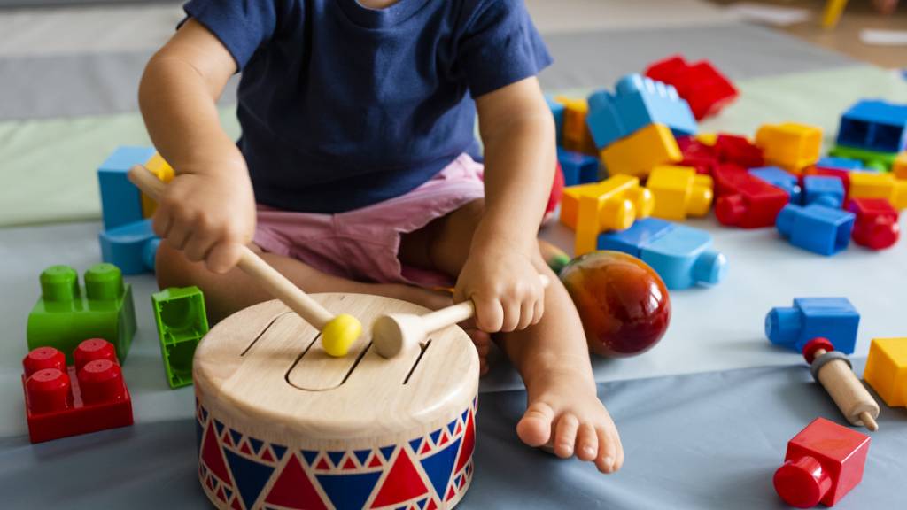 Young child at day care centre with toys 