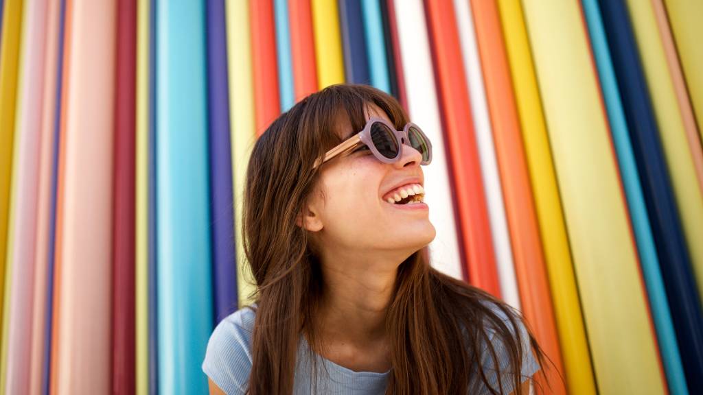 smiling woman in front of abstract background