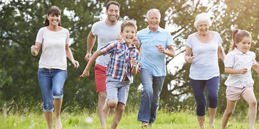 parents, children, and grandparents running outdoors