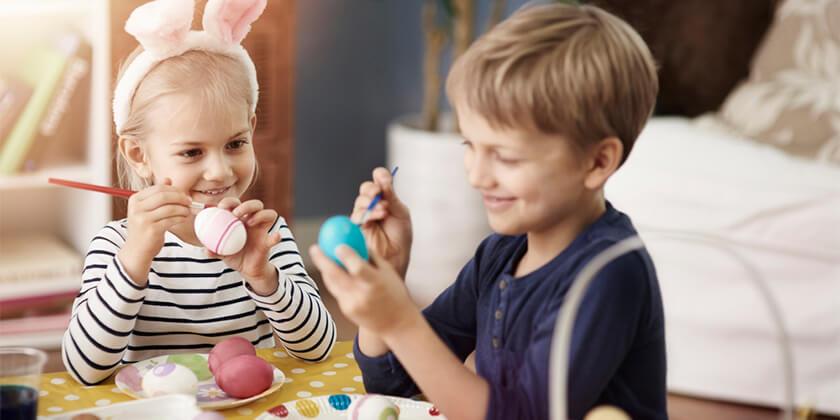 kids making easter eggs