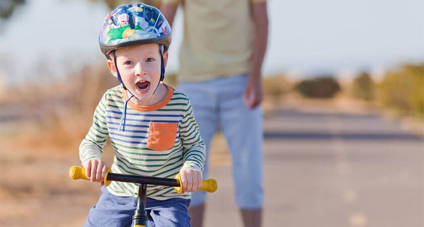 child with turning on bike