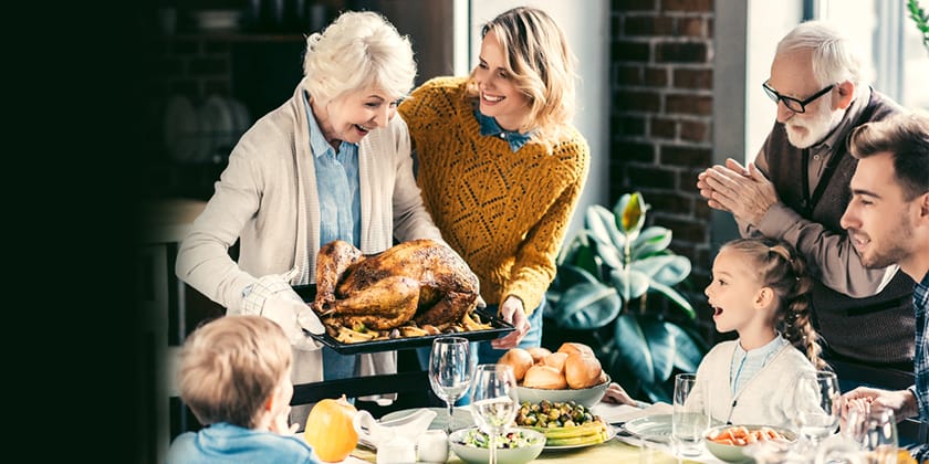 Australian family with grandparents at dinner table 