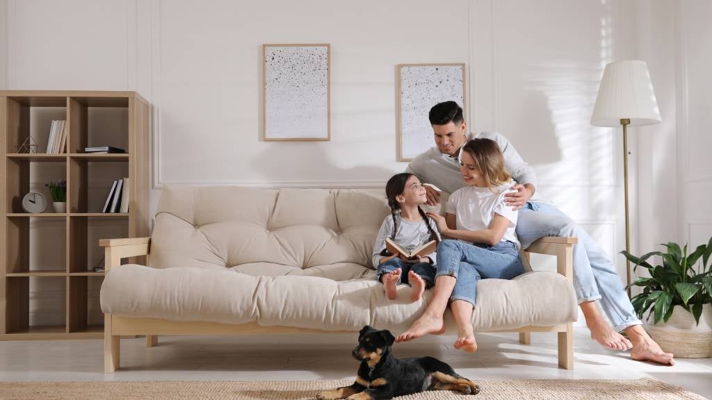 Family at home with puppy. 