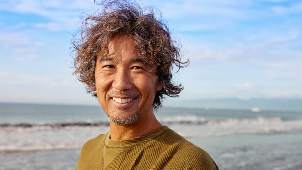 Happy man in his 50s on the beach