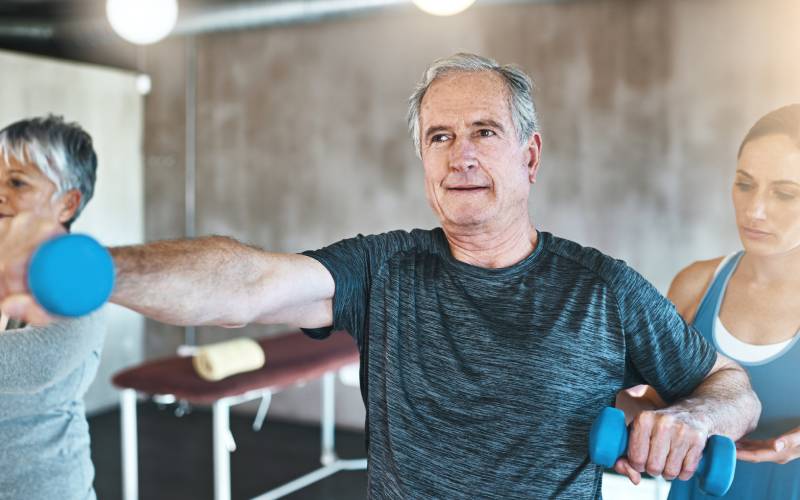 older man in 60s doing workout session