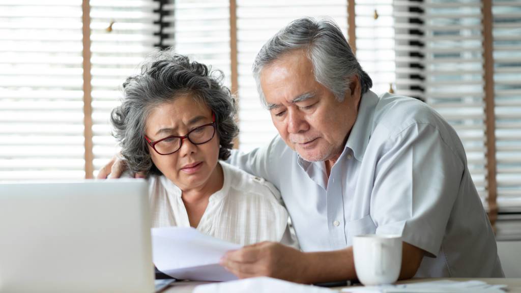 older couple discussing funeral costs