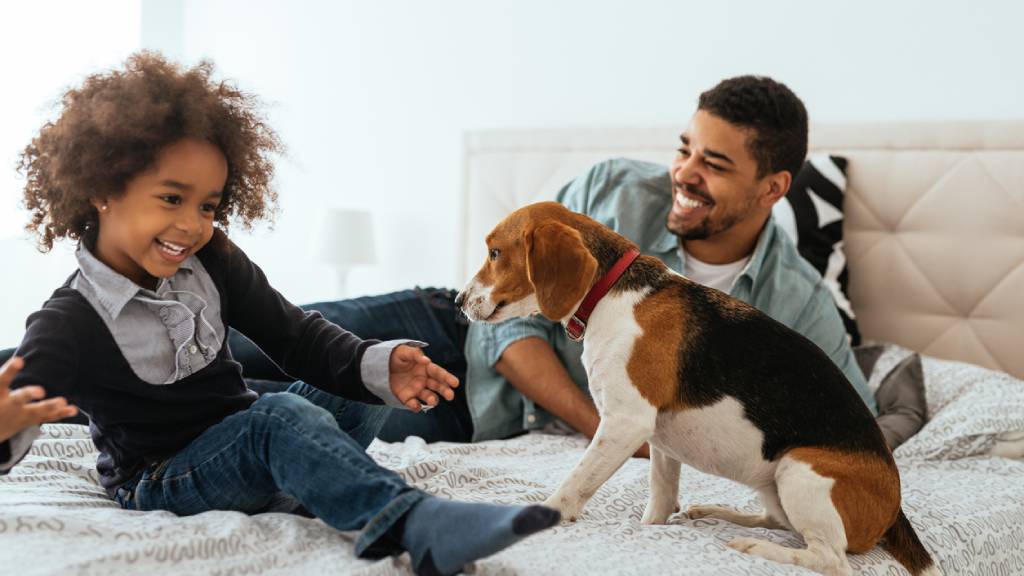 young family with dog at home