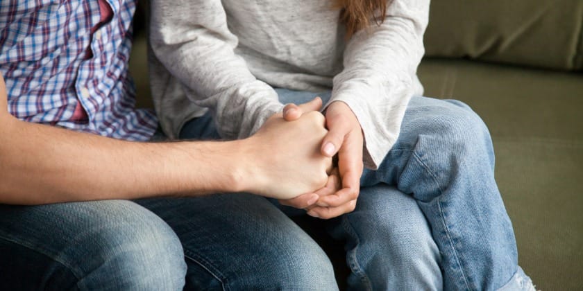 Couple holding hands