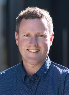 Headshot of a man smiling 