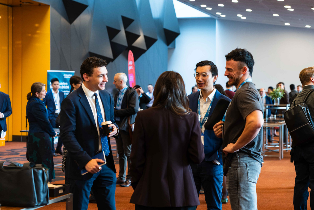 People chatting and networking at a conference 