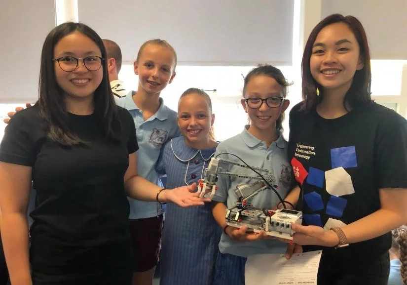 Young girls from Sutherland North Public School taking part in the STEM pilot, posing with UTS staff.