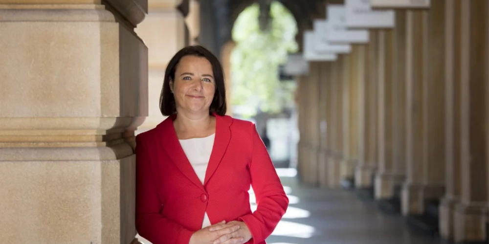 Elayne Grace, CEO of the Actuaries Institute, photographed in a sandstone colonnade.