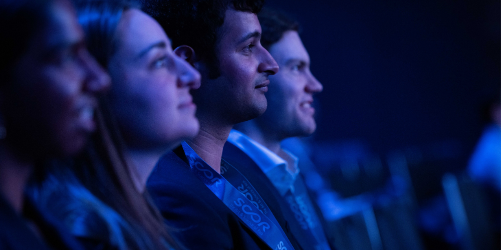 A photo of actuaries listening to a conference session
