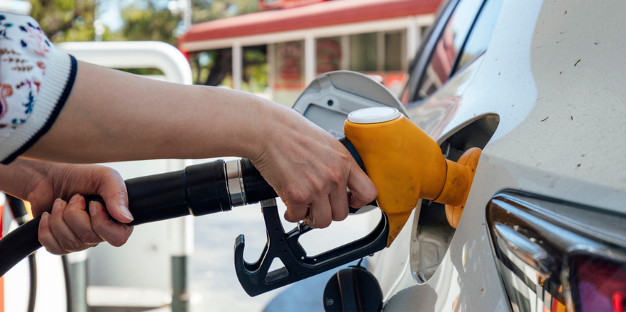 A fuel bowser with a person filling up