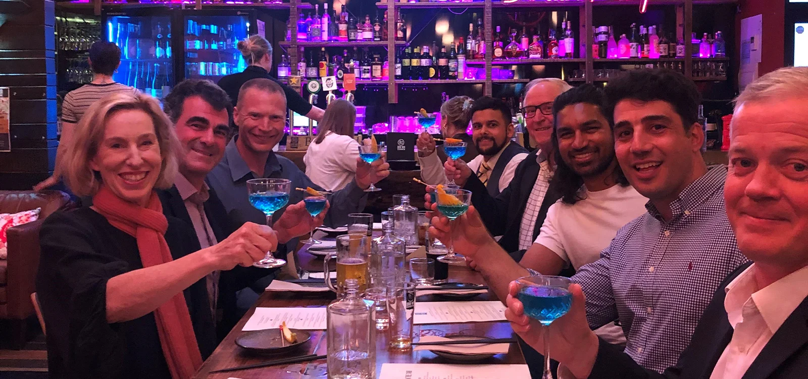 Institute Vice President Naomi Edwards (front left) and a group of Tasmania-based members enjoy the 'Actuarial Madness' cocktail.
