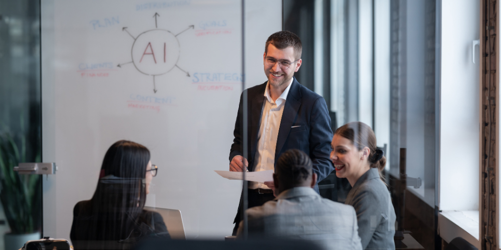 Diverse business team in a modern office during a meeting, discussing artificial intelligence strategy. 
