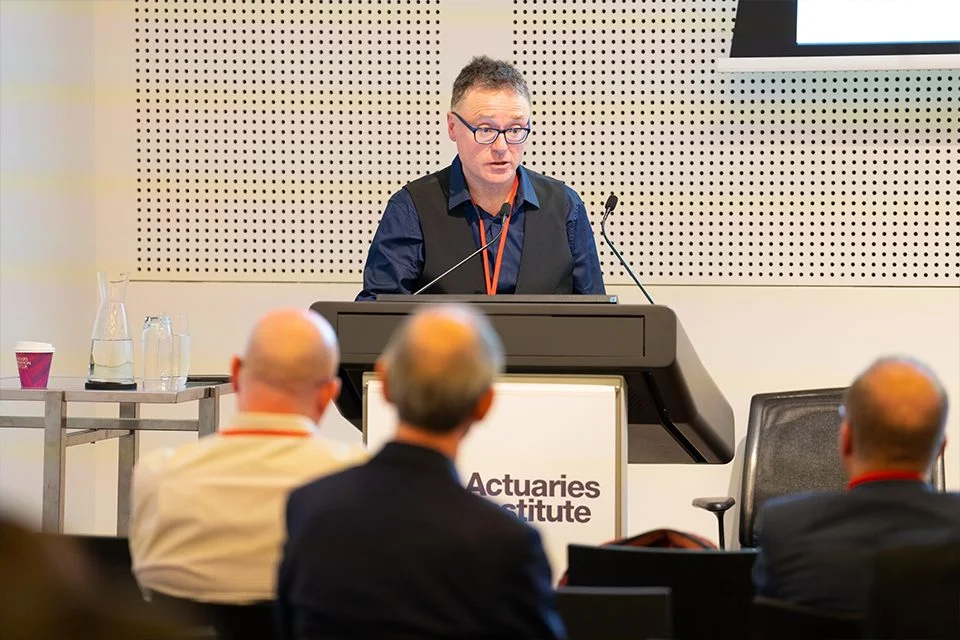 Mark Berry addresses the audience at the 2022 All-Actuaries Summit.