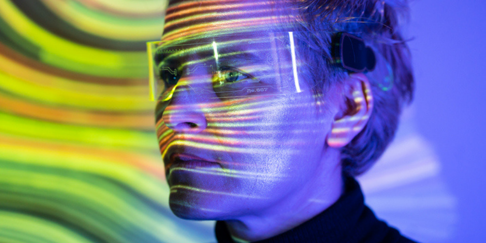 Vivid hues paint a woman's face with vibrant streaks of colourful light