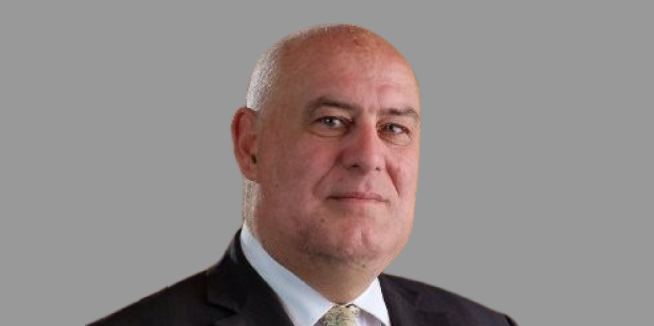 Male looking at camera, with black suit