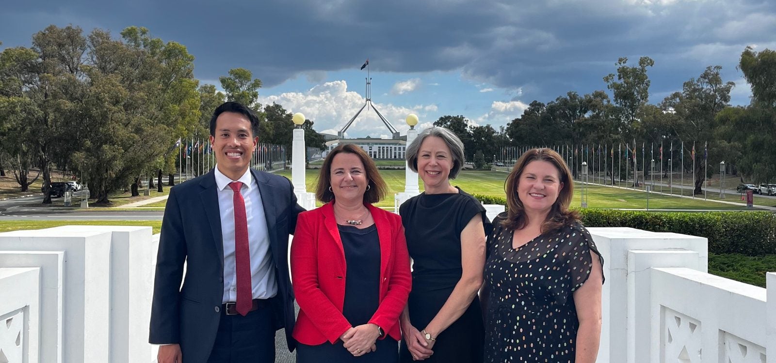 Photo of Aiden, Vanessa, Elayne, and Clare outside parliament house
