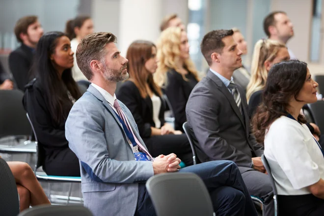 Audience Listening To Speaker At Conference Presentation