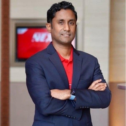 Man in suit with arms crossed