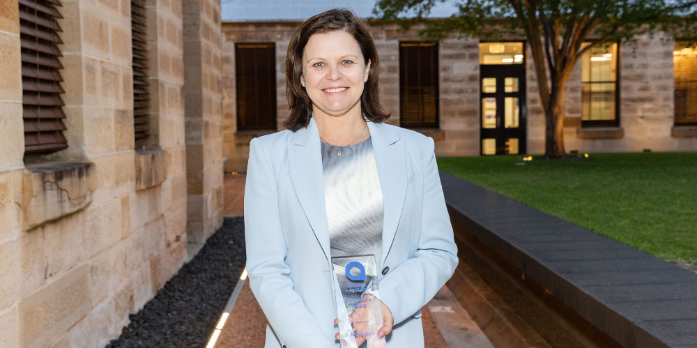 Photo of the 2024 Presidents Award winner for the Volunteer of the Year, smiling in blue jacket
