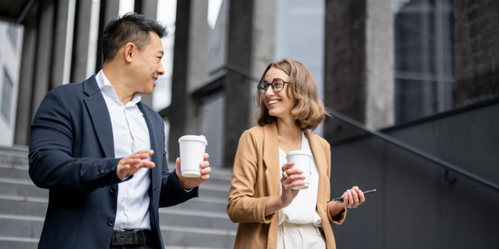 Image shows two colleagues walking to an Actuaries Institute event.